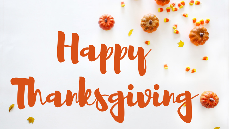 White background with pumpkins and autumn leaves with the words Happy Thanksgiving written in orange text